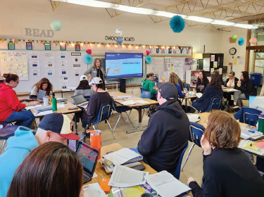 group of educators sitting in classroom